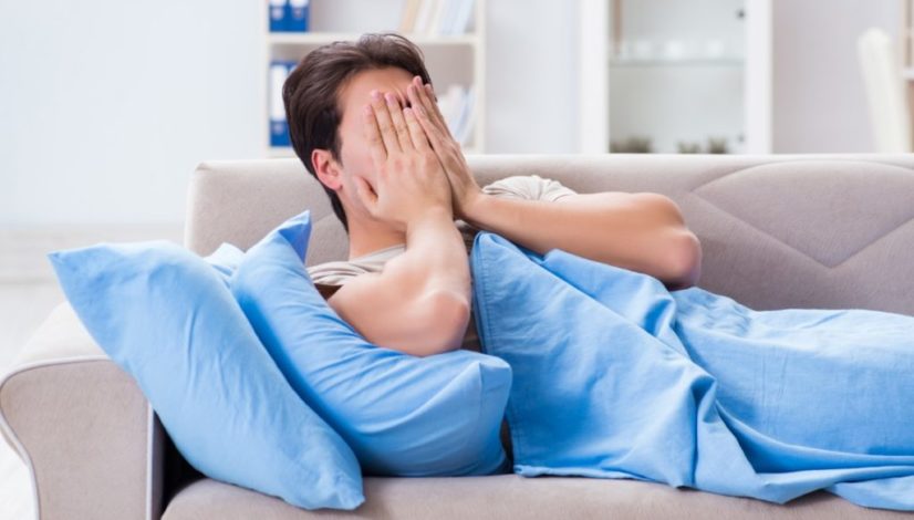 Man suffering from insonmia in bed at home